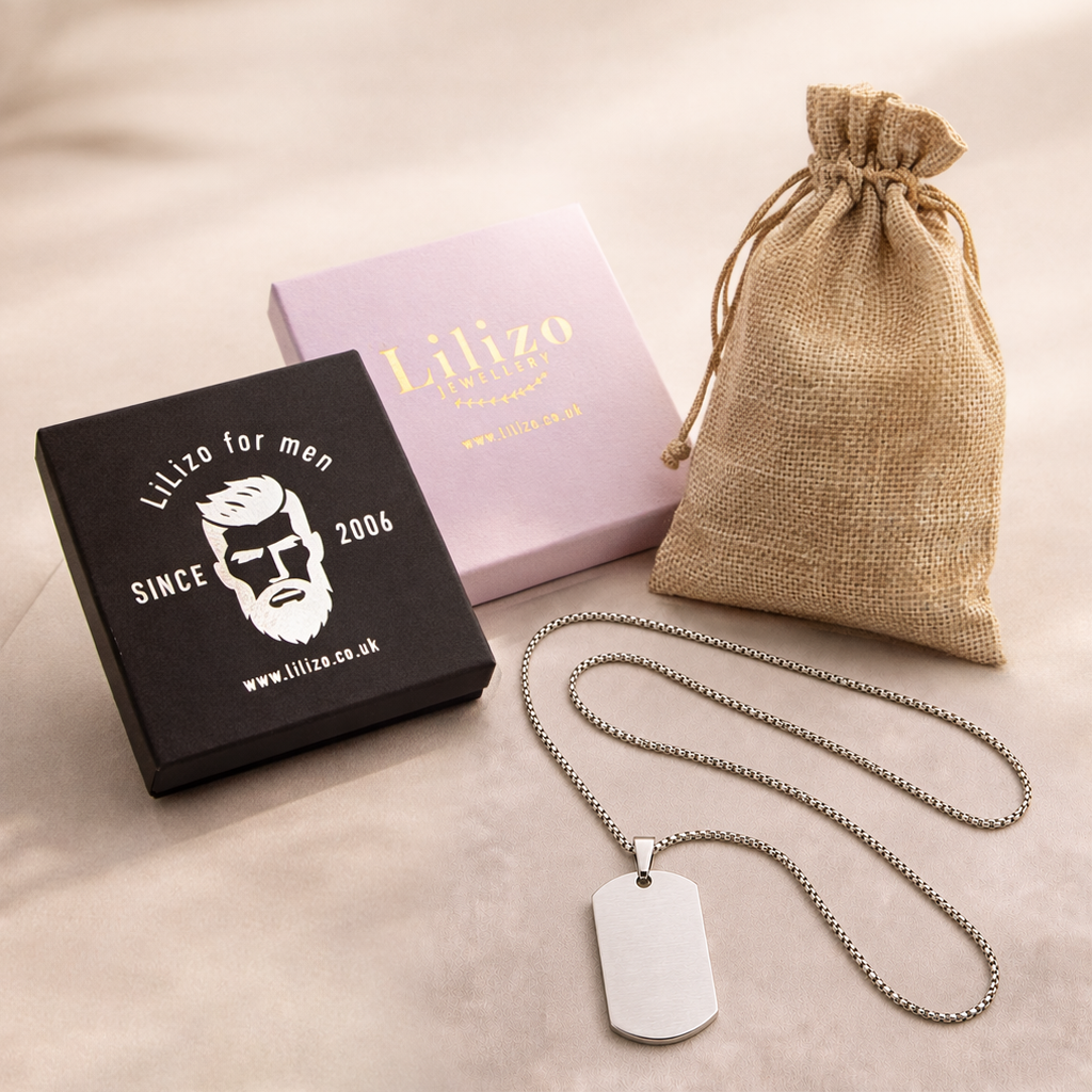 Silver personalised baby keepsake necklace worn on model, engraved with baby name Violet, birth weight, height, date and time.