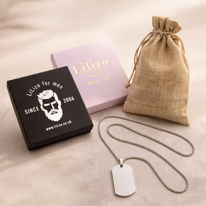 Silver personalised baby keepsake necklace worn on model, engraved with baby name Violet, birth weight, height, date and time.