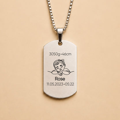 Silver personalised baby keepsake necklace worn on model, engraved with baby name Violet, birth weight, height, date and time.