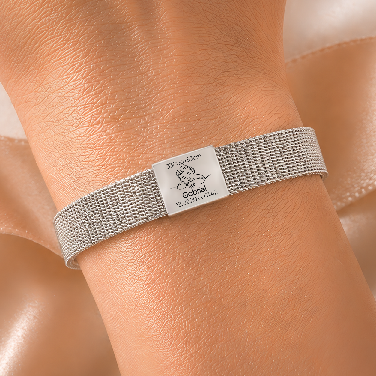 Personalised baby name engraving bracelet in silver and gold with birth details on adjustable mesh strap