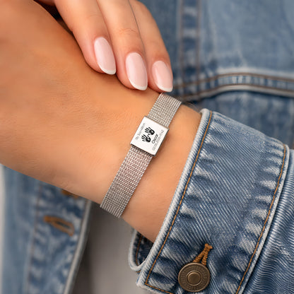 Engraved baby name bracelet showing birth weight, height, date and time on polished metal plate