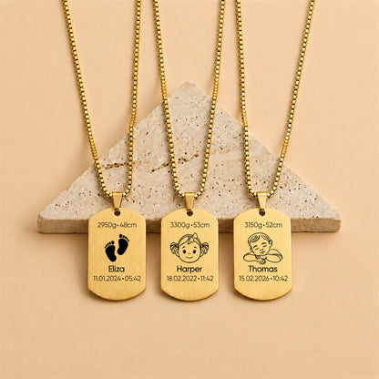 Three gold necklaces with engraved tags on a beige background