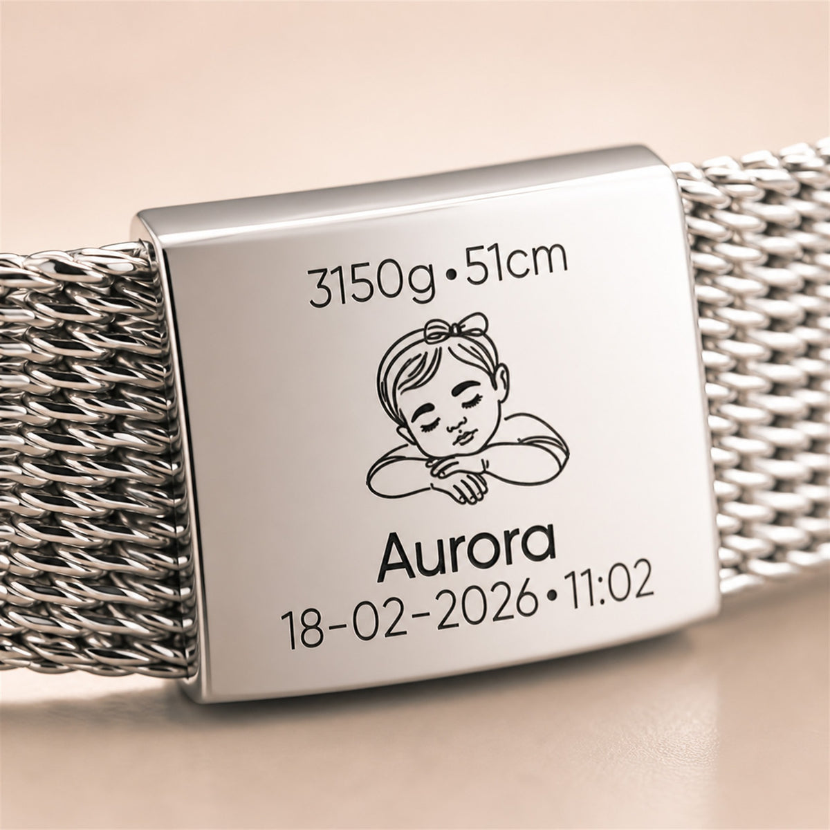 A close-up of a silver metal mesh bracelet with a rectangular engraved clasp. The clasp features a sleeping baby illustration and custom text reading '3150g•51cm', 'Aurora', and '18-02-2026•11:02'.