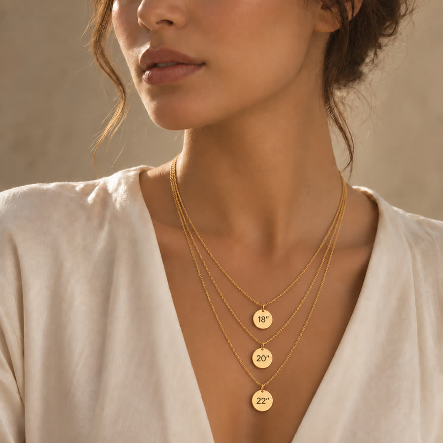 Model wearing three pendant necklaces at 18, 20 and 22 inch lengths